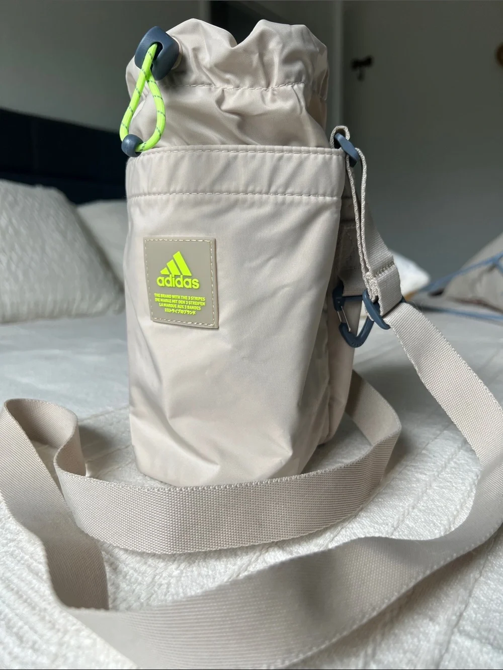 Adidas Beige Hydration Pouch with Neon Green Accent, crossbody